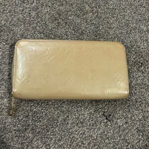 Cream and gold LV wallet. Used condition.Needs cleaning.